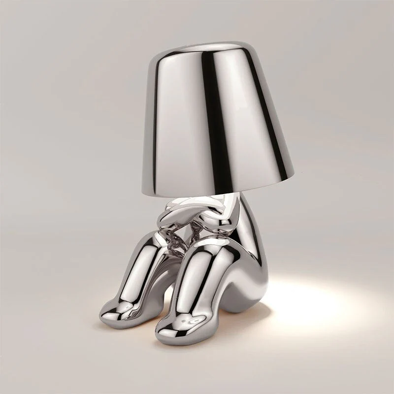 Metallic table light with reflective artistic form - Image 10